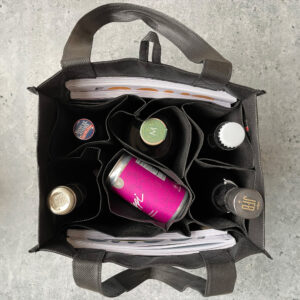 Full Pour Beverage tote bag in black with white logo on front - overhead shot of bag with products inside