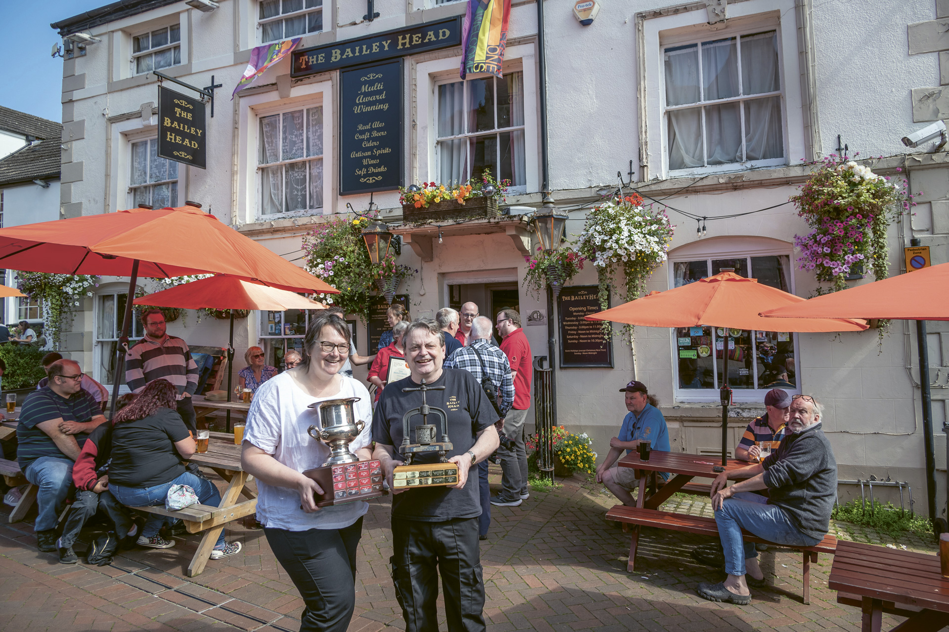 Owners Grace Goodlad and Duncan Borrowman pictured in front of The Bailey Head in Oswestry, CAMRA National Pub of the Year Winner 2024