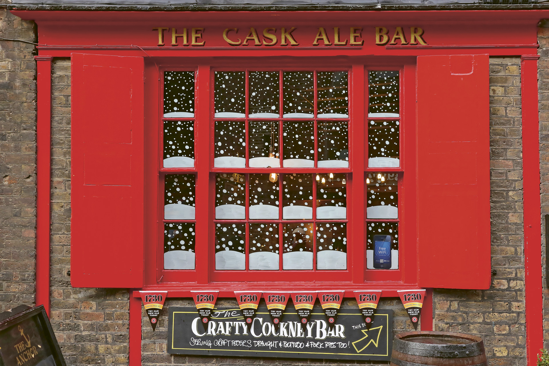 A cask ale promo window at The Anchor – Bankside in London