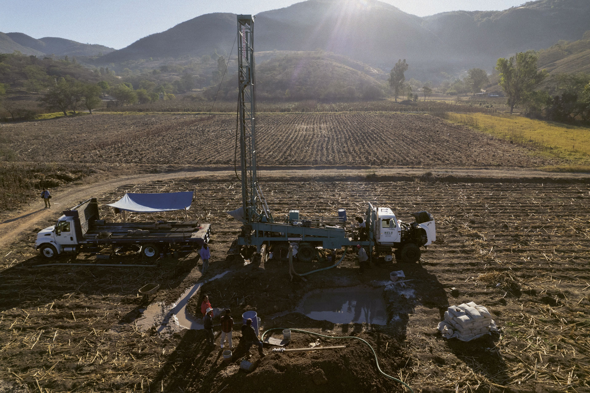 A freshly planted field with a water drill at the forefront for a water- and agriculture-security project in Atempa, Guerrero, Mexico
