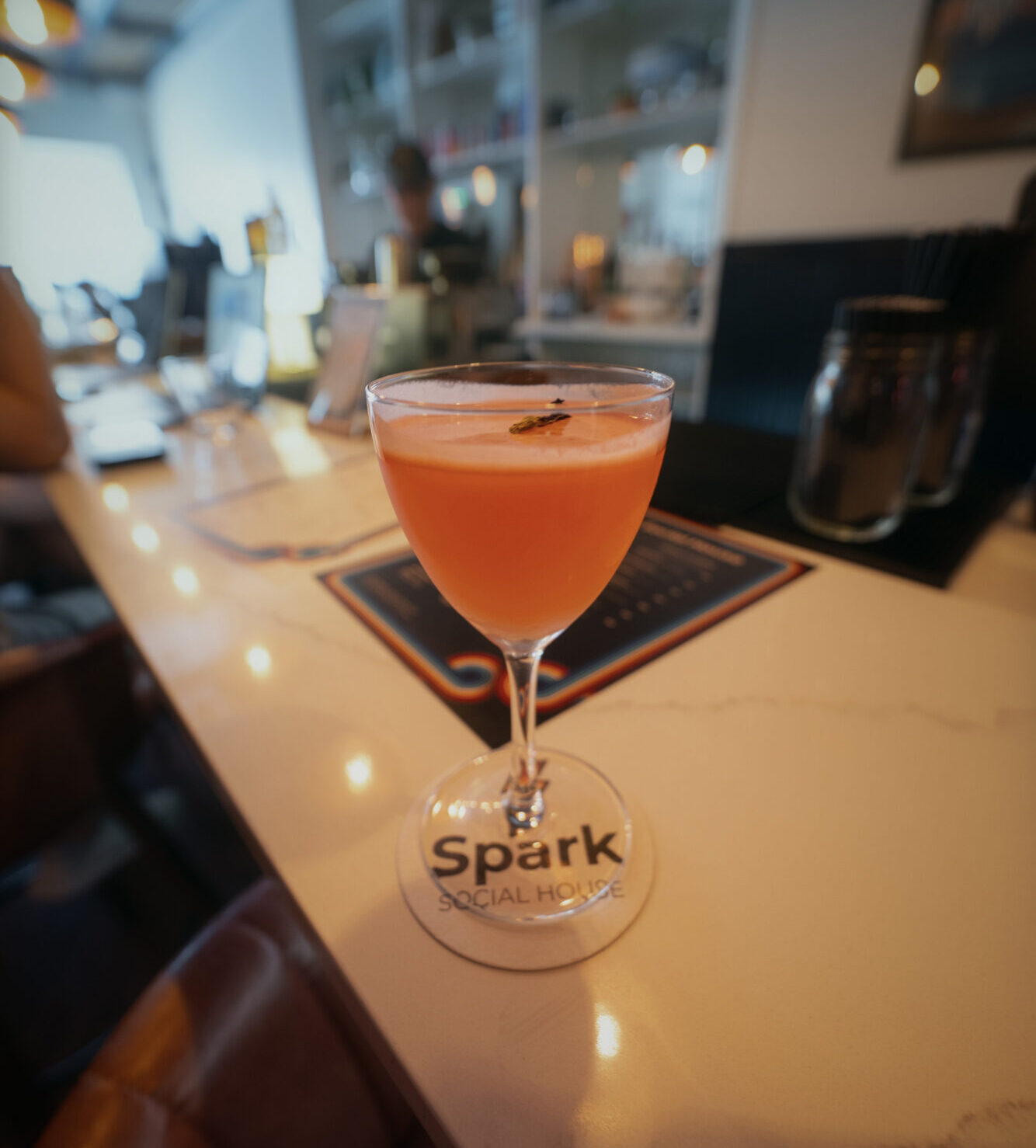 A pink cocktail on the bar at Spark Social House in Washington, D.C.